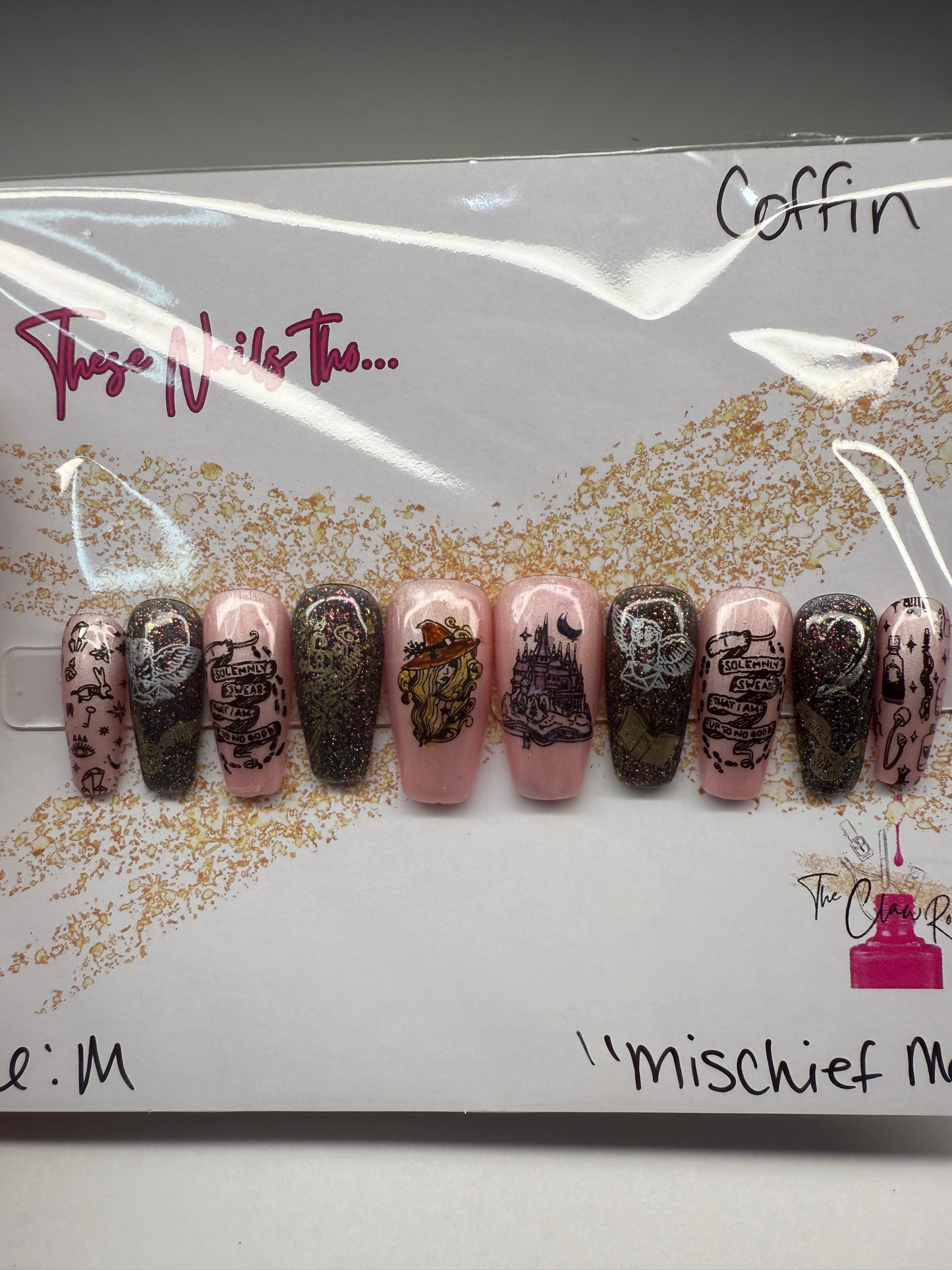 Set of nail polish samples with decorative designs on a branded card.