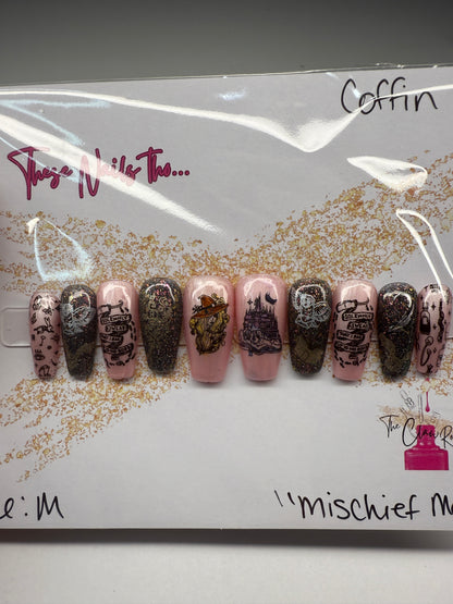Set of nail polish samples with decorative designs on a branded card.